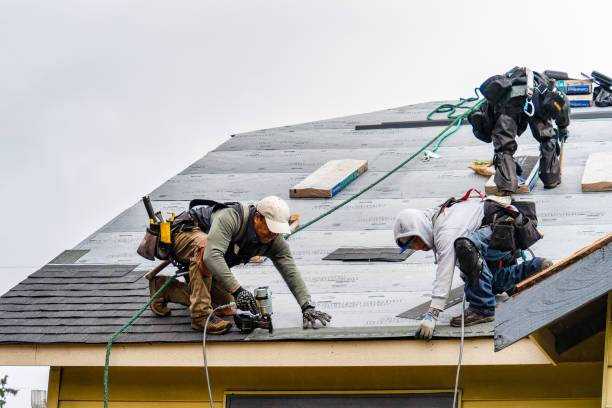 Professional Gutter Installation technician working in Westborough, MA